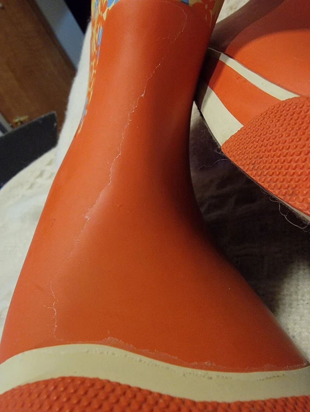 Keen orange and floral-patterned Coronado kids' waterproof rain boots